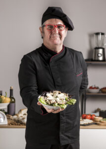 Luxhoteli high angle chef with plate
